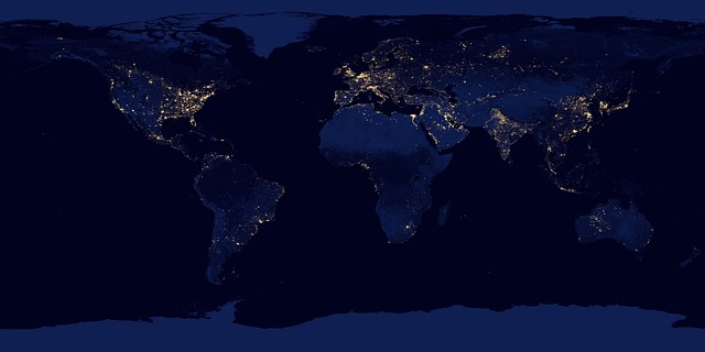 earth from space with blue glow and city lights technology background